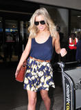 th_57879_The_Saturdays_Arriving_at_LAX_February_12_2012_19_122_58lo.jpg